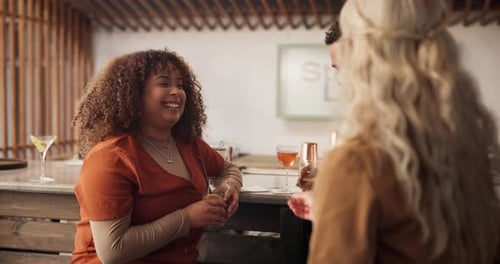 Women, man and friends with toast at bar for celebration, diversity and new years eve at social