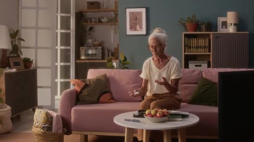 Senior Woman Checking Her Blood Sugar at Home