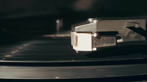 Record Player Needle Playing a Vinyl Record