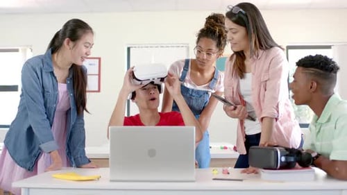 Diverse students engage with VR technology in a high school setting