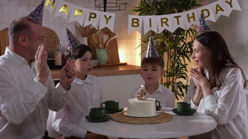 Family Celebrates Birthday at Home with Cake