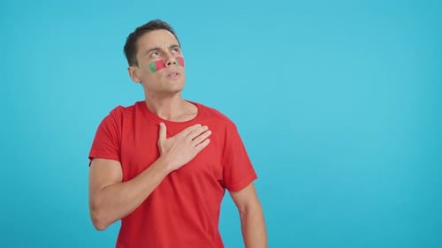 Man Listening to the Portugal National Anthem with Solemnity