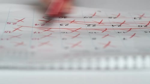 Crossing out Dates on Calendar with Red Marker