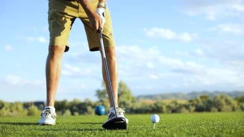 Golfer About to Swing at Golf Ball
