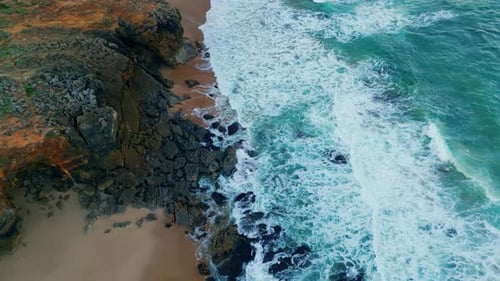 Foamy Sea Waves Washing Rocky Seashore in Slow Motion