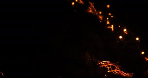 Abstract Glowing Embers Floating in the Dark