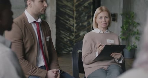 Adults Sitting in Circle Meeting, Talking