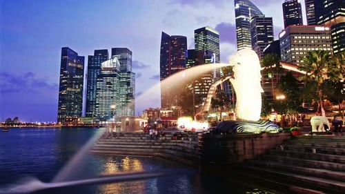 Singapore day to night time lapse over marina bay sands in southeast asia