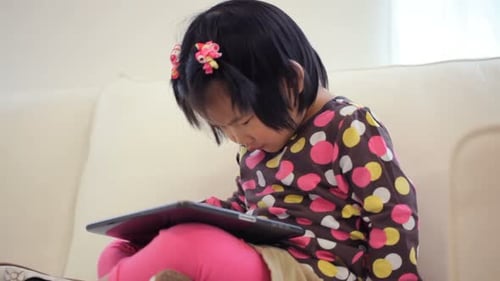 Young Girl Using Digital Tablet 2-3