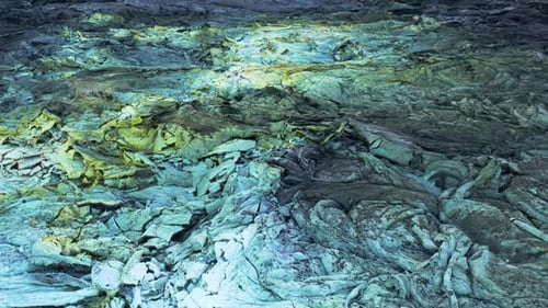 Colored mineral deposit on surface of lava field, solid layers of rock, aerial