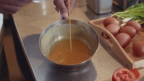 Chef Prepares Delicious Sauce in Restaurant Kitchen