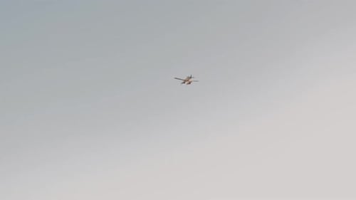 Single Engine Airplane Flying in the Blue Sky