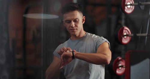 Smile Young Man Use Smartwatch on Gym Sport Technology Fit Lifestyle Male Workout Athlete Caucasian