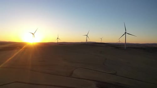 Aerial View Of Wind Power Plant At Sunset