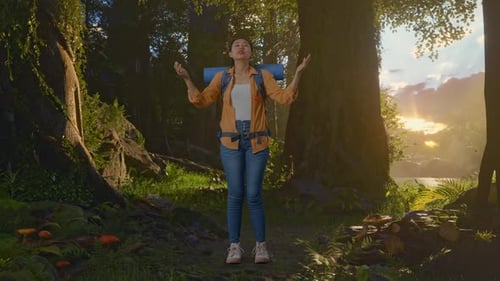 Full Body Of Asian Female Hiker Spreading Arms Enjoy While Exploring Forest Nature