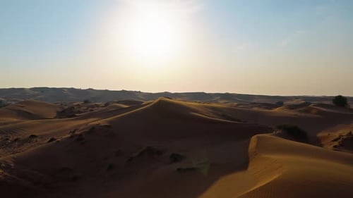Drone View of Sunset Over Sand Dunes in Dubai Desert
