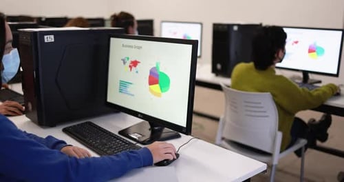 Young Students Wearing Safety Face Masks During Computer Class at University Academic