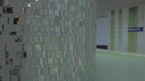 Man with cell and suitcase at subway station