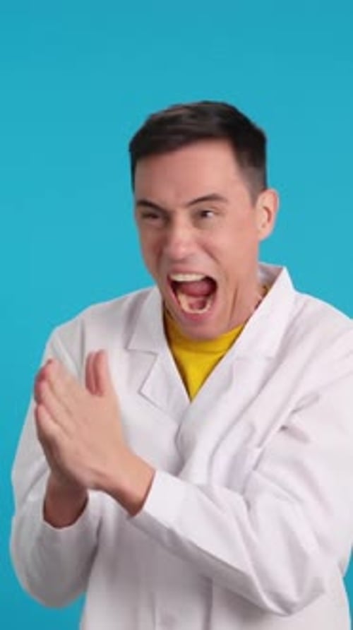 Man in Lab Coat Expressing Surprise