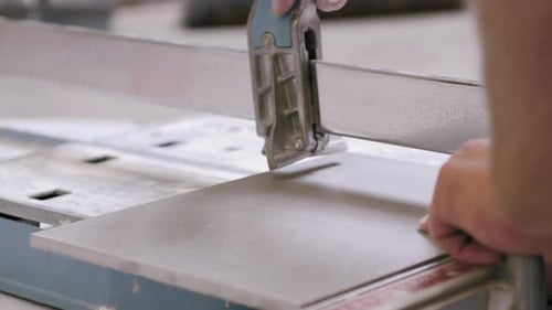 Professional stone tiler contractor cutting stone tile construction house renovation building new ap