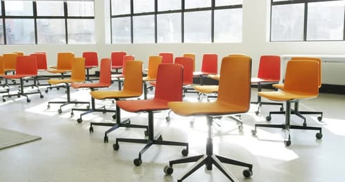 Rows of Empty Chairs in Conference Room