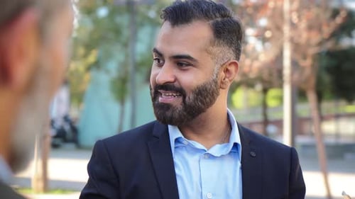 Business Professionals Talking Together in Urban Setting