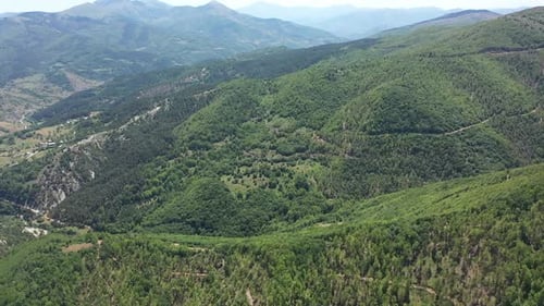 Aerial View Of Mountain Village Among Forests
