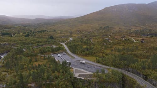 Topdown view of parking lot with motorhomes by Voringfossen falls, Norway