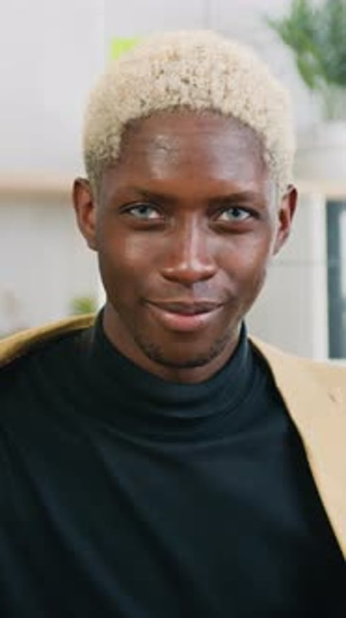 Young Man Smiling with Blonde Hair, Close Up Portrait