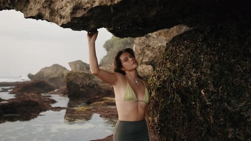 Woman Touching Rock Under Natural Arch on Beach Nyang Nyang