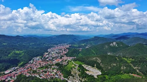 View From Rock to Town of Smolyan with Meadows for Cattle Walking and Houses Between Mountain Range