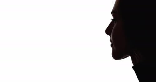 Silhouette of Woman's Face Against White Background