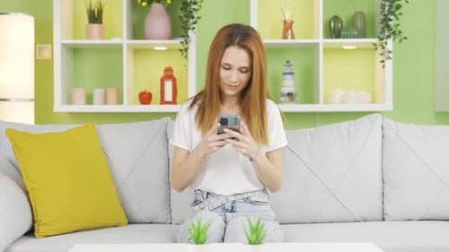 Young Woman Reacts to Bad News on Her Phone