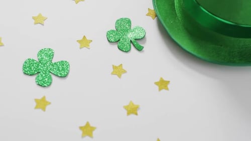 Shamrocks and stars with green hat with copy space on white background