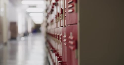 Education, learning and empty private school corridor or hallway with red lockers