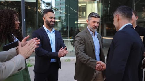 Business Professionals Engaging in a Professional Handshake During a Collaborative Meeting Outdoors