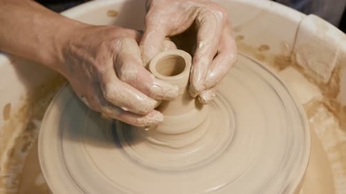 Handicraftsman Create Product On The Circle Potterswheel Close Up Isolated. Artisan Dexterity And...