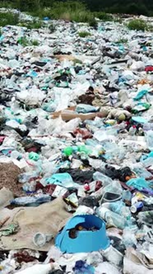 Aerial View of Plastic Waste Landfill Overflowing Prodigiously with Garbage Debris and Trash