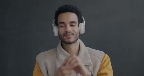 Young Adult Dancing While Listening to Music