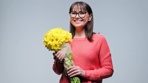 Smiling Woman Holding Yellow Daffodil Flower Bouquet