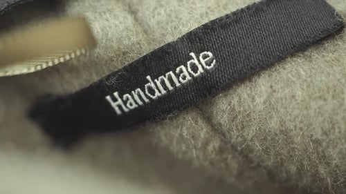 Handmade Tag on Luxurious Wool Blanket Close-Up