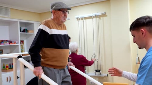 Elderly Man Practicing Walking with Physiotherapist Support in Nursing Home