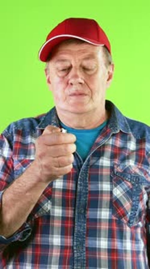 Adult with Baseball Cap Squeezing Something