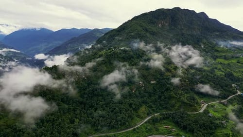 Green Mountain Valley Among Clouds in Nepal
