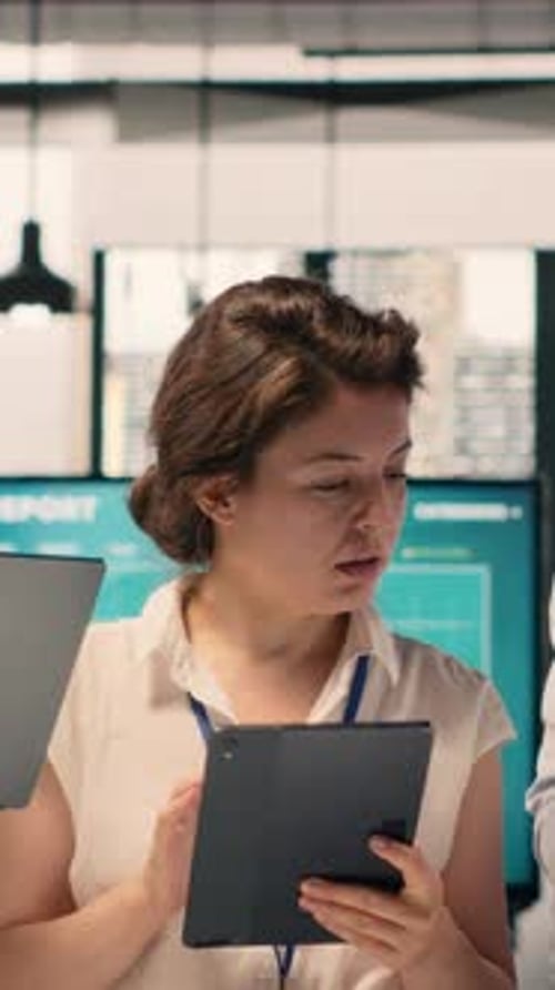 Vertical Video Portrait Multiethnic Team Working Together in Office Review Business Reports
