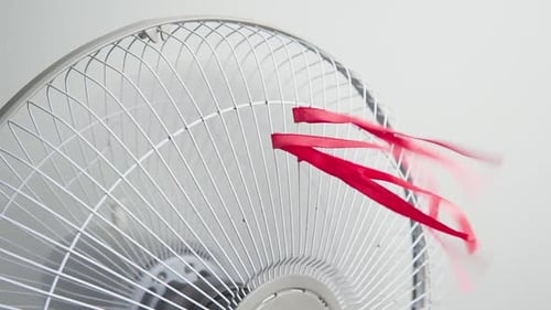 Closeup view of electric fan on a hot day