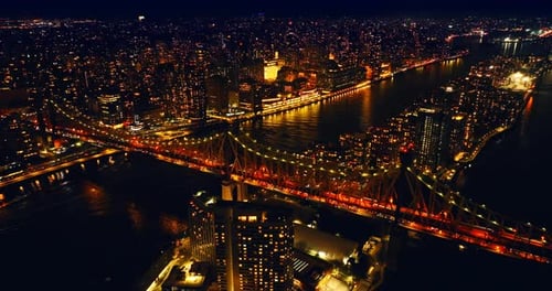 View of amazingly illuminated Queensboro Bridge with lively traffic at night.