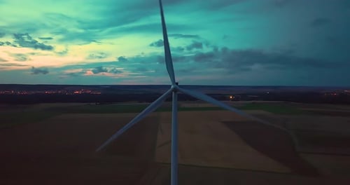 Aerial View Wind Turbines Generate Renewable Energy at Night Silhouettes of Windmills with Bright