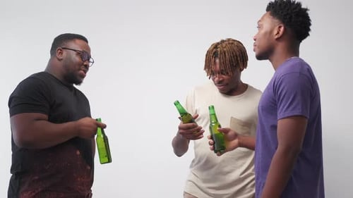 Young Adults Socializing with Bottled Beverages