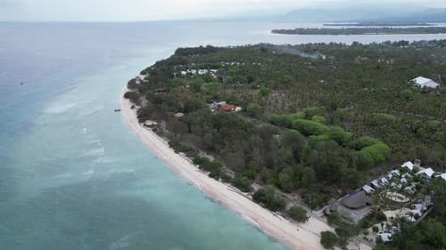 Tropical Beachfront Resort With Turquoise Ocean Aerial